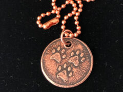 three paw copper charm