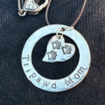 Tripawd Mom sterling silver 3-paw heart necklace and 20" cotton cord.